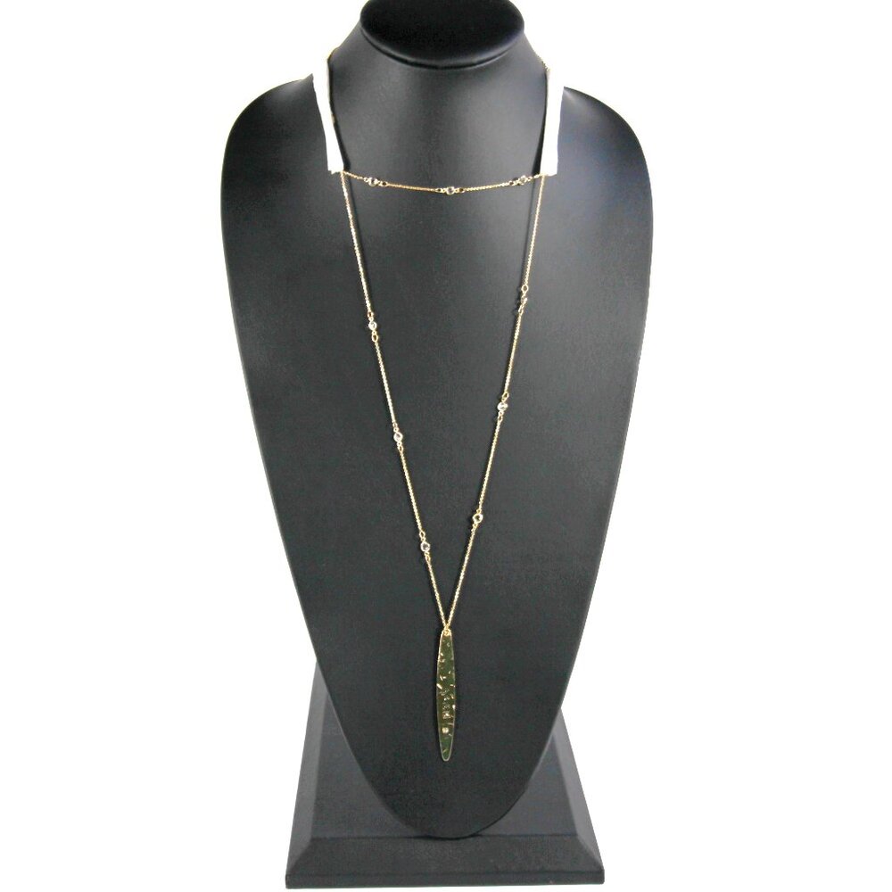 NWT Express Gold Tone Necklace with a Gold Tone Pendant inscribed "Love" on it.